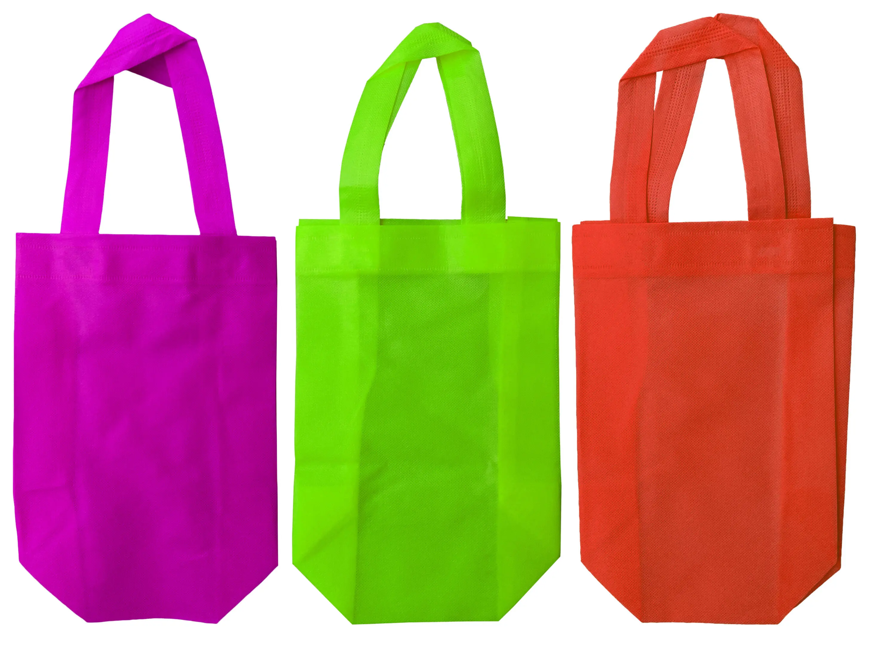 three pieces of non-woven fabric tote bags in purple, light green and orange isolated on white background. sets or collections with various colors. eco-friendly polypropylene bags
